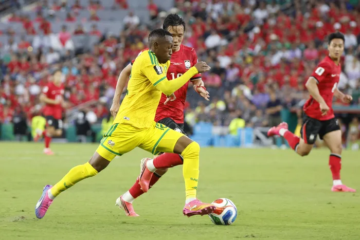 Thapelo Maseko challenged by Oh Hyeongyu of South Korea during the FIFA World Cup 2026 match, has helped Bafana Bafana rewrite South African football history with his perfomances.