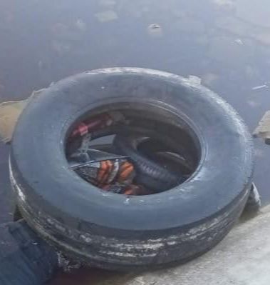 Body with tyres over head found in vlei