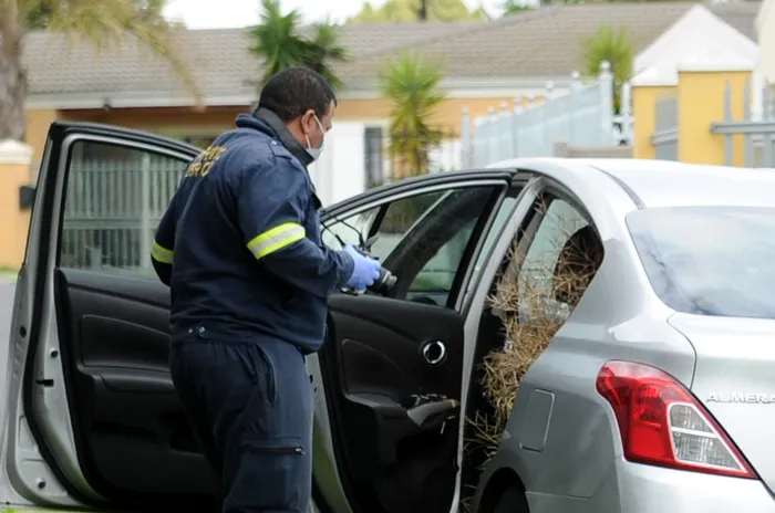 Police and crime scene experts were still on the scene in Jaberhon Street, Kuils River, after the body of an e-hailing driver was discovered in a car on Thursday morning. Picture: Ayanda Ndamane/African News Agency