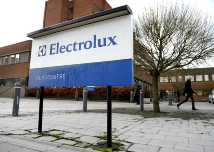 A person walks past Electrolux headoffice in Stockholm.