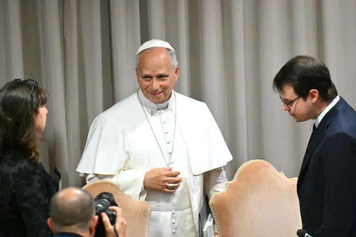 Pope Leo XIV speaks with Co-founder of US artificial intelligence (AI) company Anthropic, Christopher Olah (Right) and the Professor of Catholic Social Thought & Practice at the Durham University, Anna Rowlands, at the end of the presentation of the first Encyclical Letter “Magnifica Humanitas”, focused on the rise of artificial intelligence, in The Vatican on May 25. 