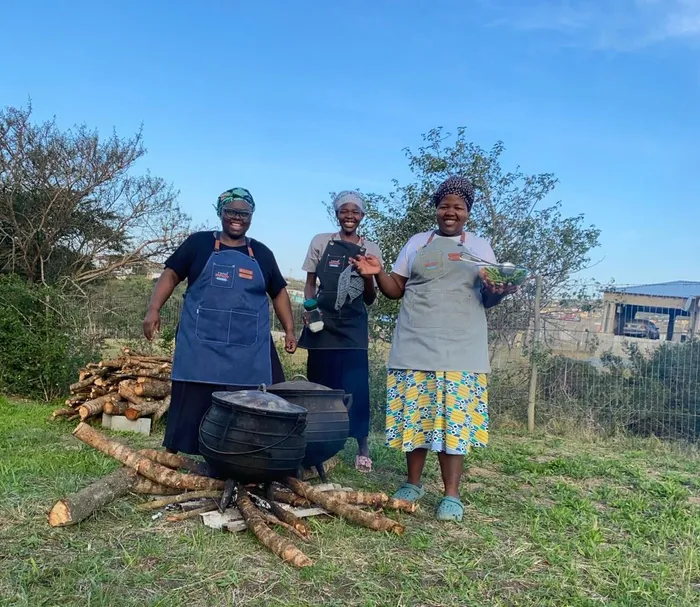 Phumeza Stuurman (black dress), Zintle Magalela (centre) and Azakhiwe Sijila taken at Seya Location, Nxarhuni Village in East London.