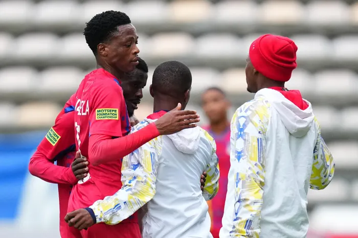 Milford FC players embrace following their win over Cape Town City FC in their opening match of the PSL's Promotion-Relegation play-offs.