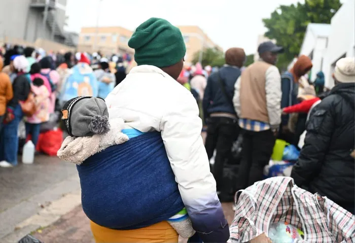Women and children are among the more than 2000 Zimbabwean nationals who stood outside the Zimbabwean Consulate in District Six before being moved to the Epping Repatriation Centre for processing ahead of their return home.
