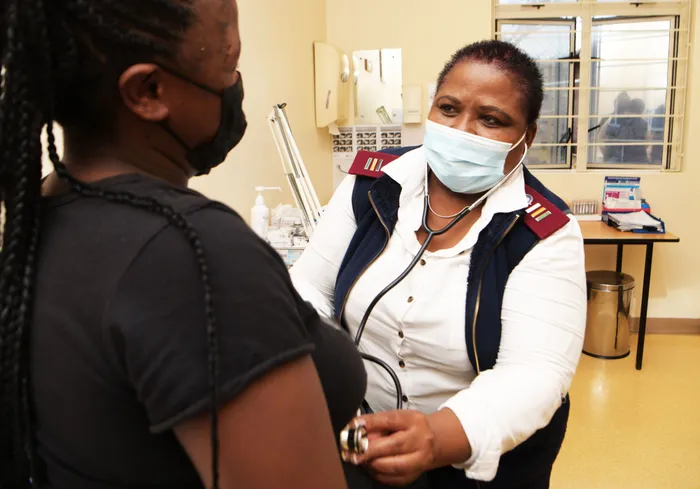 Thembeka Ntoyanto, a Clinical Nurse Practitioner at Gugulethu Clinic, helps a patient. Picture: City of Cape Town