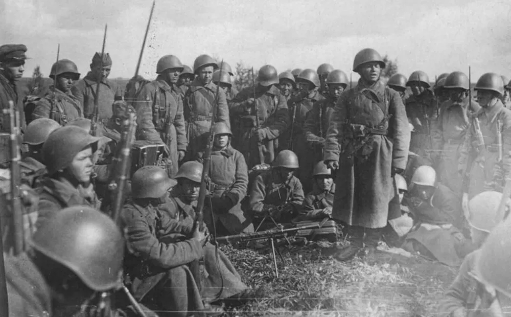 Soldiers of 166th Rifle Division gather before a battle at distant outskirts of Moscow, October 1941