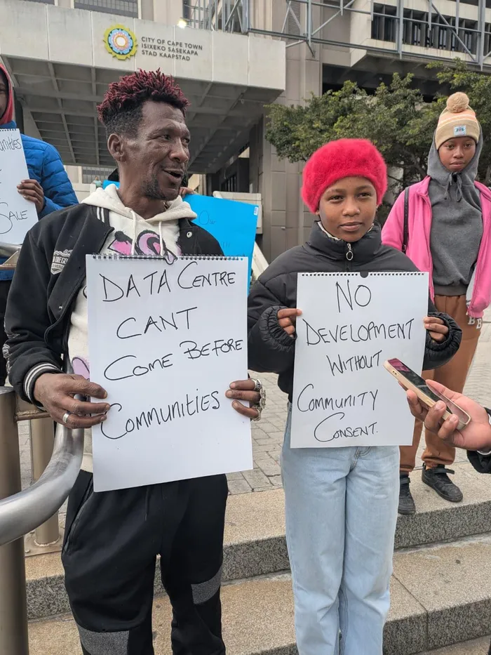 Members of the Housing Assembly demonstrated outside the Cape Town Civic Centre on Tuesday, as the City of Cape Town Municipal Planning Tribunal heard objections concerning a proposed 174 MVA hyperscale data centre development at King Air Industria.