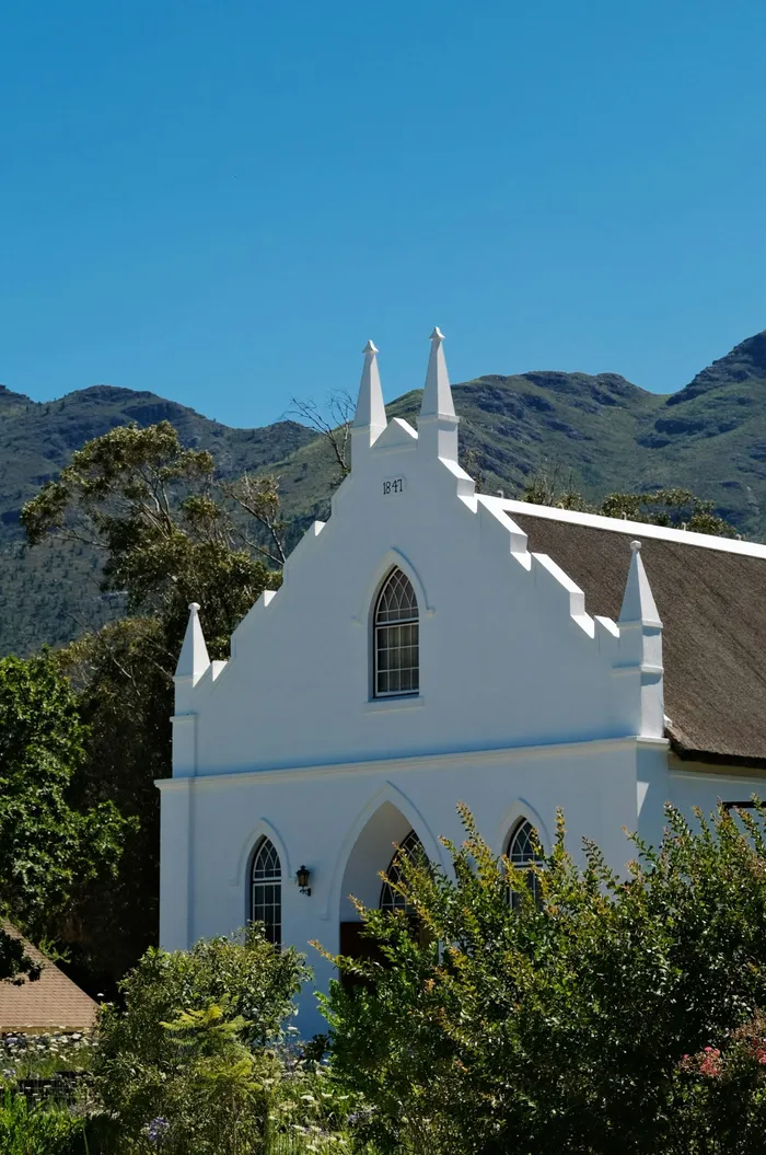 The village is compact enough to explore on foot, making it ideal for a leisurely morning stroll. Historic Cape Dutch buildings, art galleries, leafy streets and mountain views give the town much of its charm.