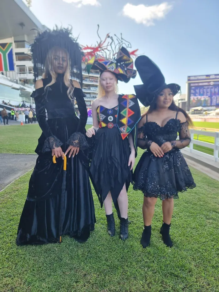 Shameellah Ngcobo, Nonhlanzeko Zulu and Hlengiwe Ngcemu made a stylish statement at the 2026 Hollywoodbets Durban July, turning heads in coordinated looks designed by fashion designer Zandile Maphumulo.