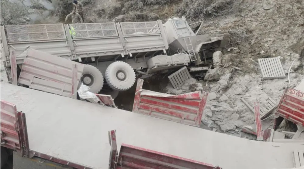 Two mangled up trucks after an accident. 