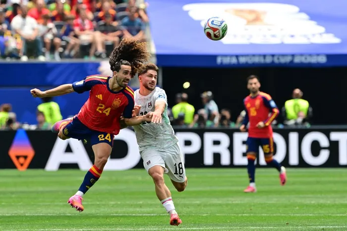 Spain defender Marc Cucurella and Austria midfielder Romano Schmid fight for the ball during the 2026 World Cup round of 32 football match at the Los Angeles Stadium in Inglewood on Thursday. 