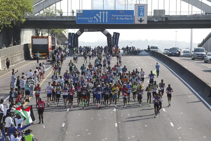 Runners during last year's Comrades Marathon passing Tollgate bridge entering Durban. This Sunday's race is an up run to Pietermaritzburg.