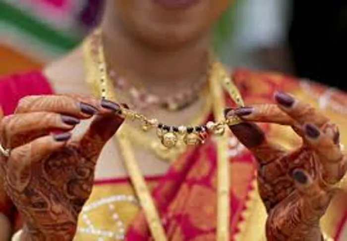 The suspects fled with the elderly woman's thali.