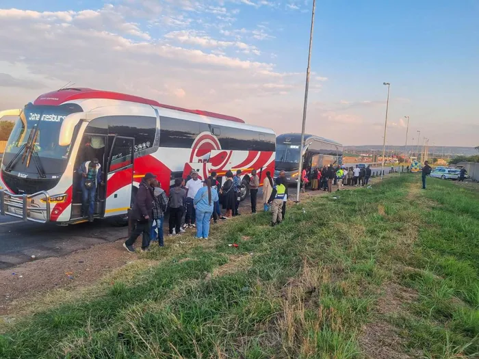 Law enforcement officers conduct inspections at the Baobab Toll Plaza near Musina, where 50 undocumented foreign nationals were deported and seven buses and taxis impounded during a crackdown on illegal cross-border transport operations. 