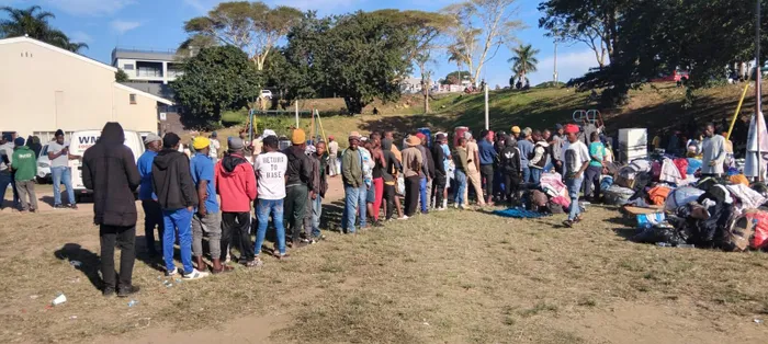 Hundreds of Malawain residents gathered at the Sherwood Hall in Sydenham with their belongings after fleeing from several informal settlements in Clare Estate