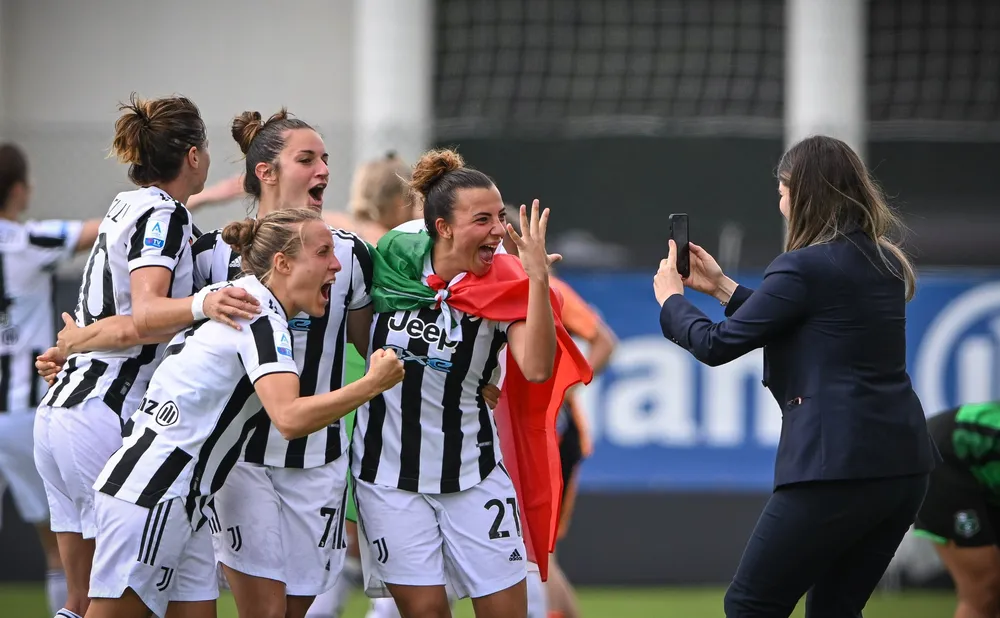 Rosella Marrai-Ricco taking a photo as the Juventus Women's team celebrate winning a fifth consecutive league title earlier this year.