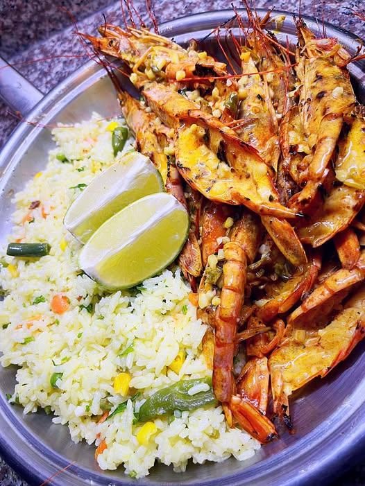 Pan-fried peri-peri prawns with creamy sauce and savoury rice