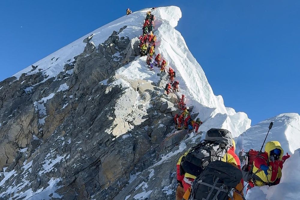 Missing Everest climber crawls back to base camp alive