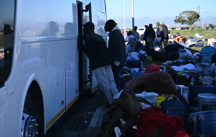 Foreign nationals wait for transport as repatriation efforts continue following anti-illegal immigration protests and intensified immigration enforcement across South Africa.