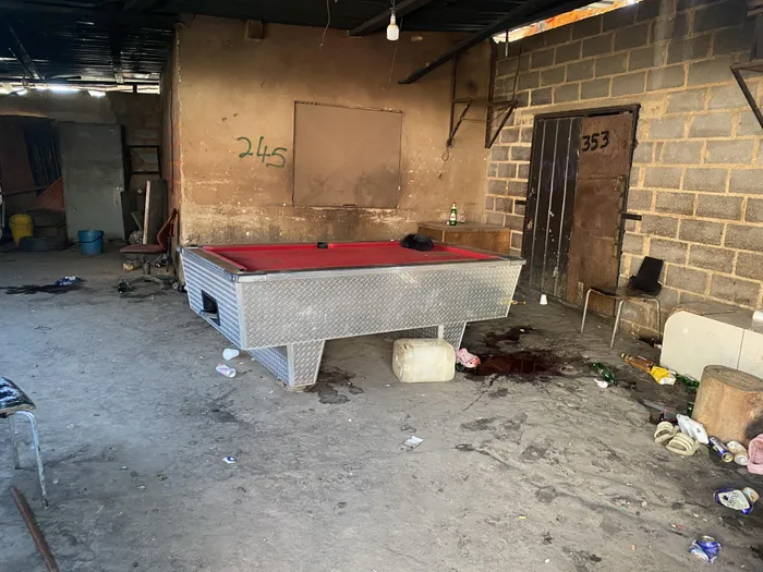 Police investigate multiple crime scenes within the Jumpers informal settlement in Cleveland, where gunmen opened fire on residents on Tuesday night.