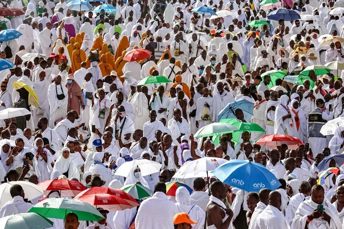 Muslim pilgrims pray on Saudi Arabia's Mount Arafat, also known as Jabal al-Rahma or Mount of Mercy, during the climax of the Hajj pilgrimage early on Tuesday