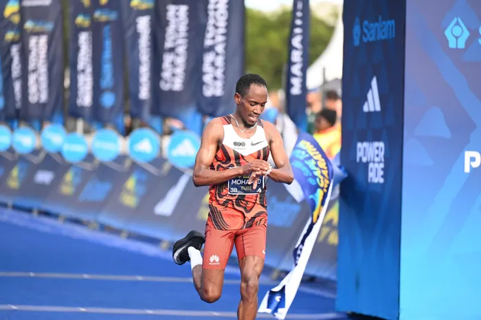 Cape Town Marathon champion Mohamed Esa won admirers after waiting at the finish line to congratulate fellow runners, including his idol Eliud Kipchoge.