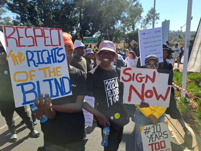 Activists including blind, visually impaired take to streets in bid for ...
