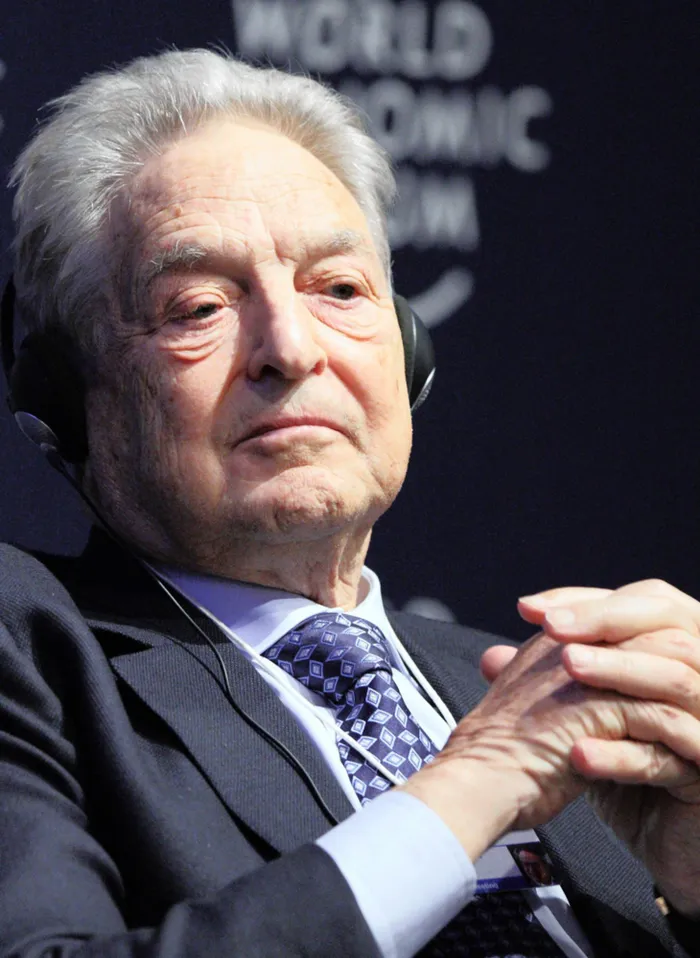 George Soros, founder of Soros Fund Management LLC, listens during a session on the second day of the World Economic Forum (WEF) Annual Meeting 2011 in Davos, Switzerland, on Thursday, Jan. 27, 2011. The World Economic Forum in Davos will be attended by a record number of chief executive officers, with a total of 2,500 delegates attending the five-day meeting. Photographer: Tomohiro Ohsumi/Bloomberg *** Local Caption *** George Soros