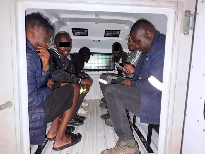 Some of the suspected undocumented Malawians that were found in a truck at a roadblock in Mooi River headed in the direction of Durban.