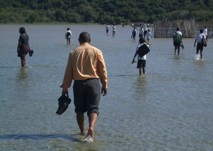 School prinicipal, Thokozani Tsilo begins his hour walk to his car after a day teaching at eNtovukeni Primary School. Picture: Fred Kockott