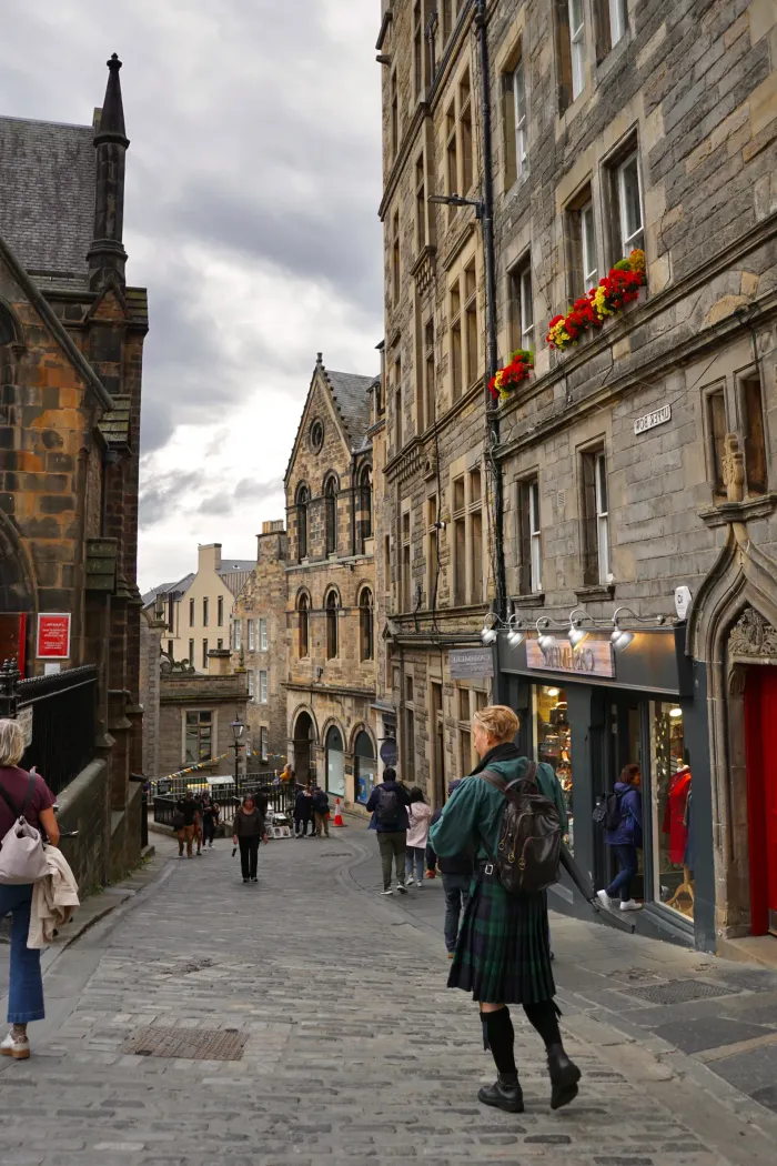 

A scenic Edinburgh street paved with cobblestones, highlighting its historic buildings and vibrant energy.
