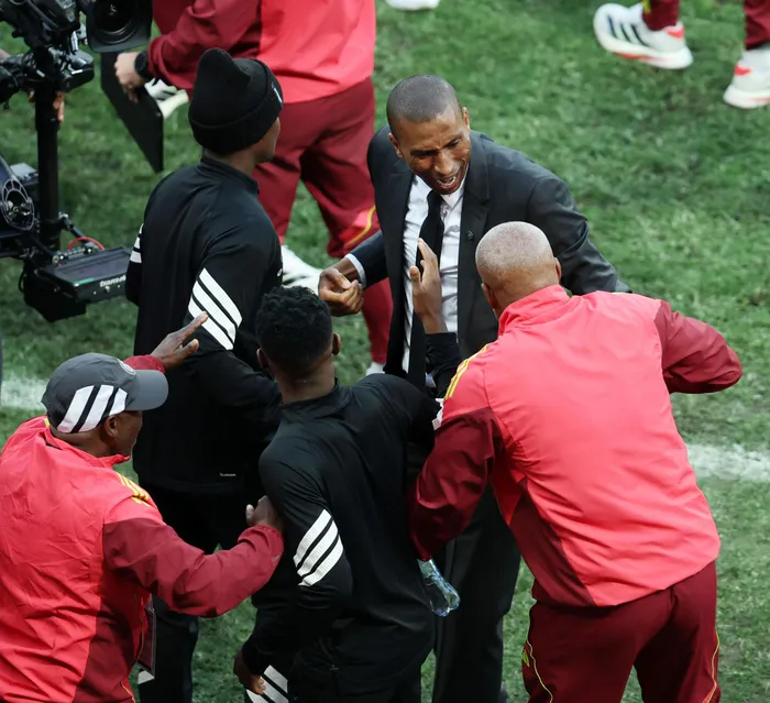 Orlando Pirates head coach Abdeslam Ouaddou celebrates with his staff after winning the Betway Premiership.