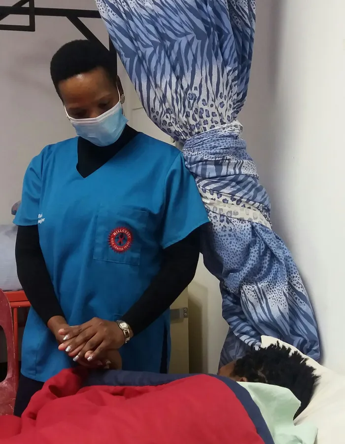 Hillcrest Aids Charity Trust counsellor, Thobeka Ntshangase, comforts a patient diagnosed with cancer at the centre’s Respite Unit. Picture: Tanya Waterworth