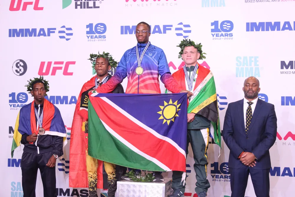 Veja Hinda (centre) brought home Namibia's first gold medal at an offical IMMAF tournament