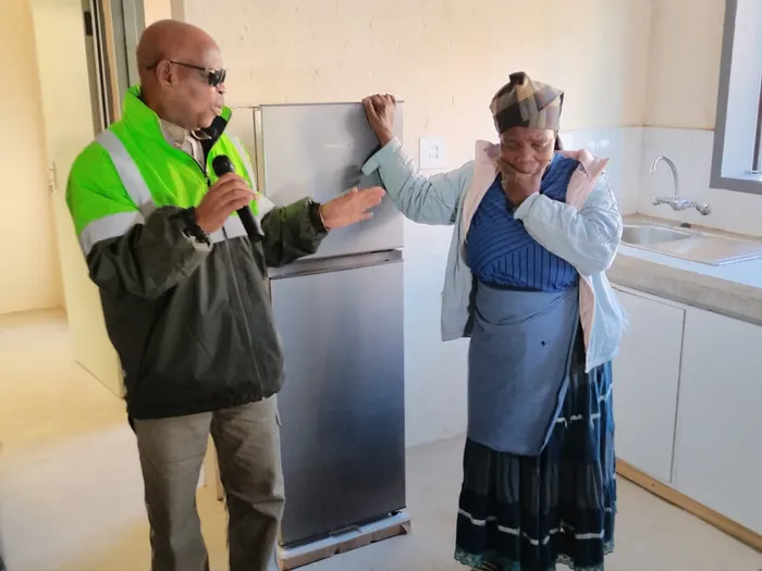 New Jika Joe CRU housing project resident gogo Sylvia Ndlela is engulfed by emotion, as she thanks the Human Settlements and Public Works MEC Sipho “KK” Nkosi. Picture: Steven Makhanya