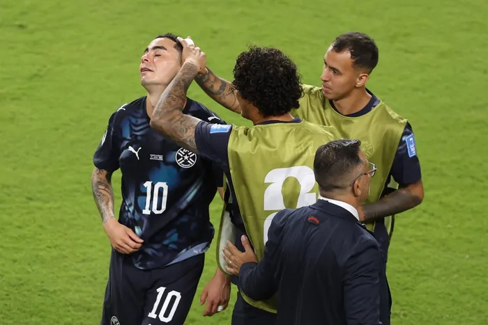Paraguay attacker Miguel Almiron was sent off after covering his mouth while he appeared to direct a comment at Turkey's Mert Muldur.