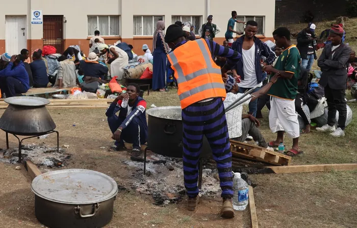 Scores of foreign nationals, with some carrying babies on their backs, still remain displaced in Sherwood. Private entities have provided them with temporary shelters such as stretch tents, food and hygiene essentials. 