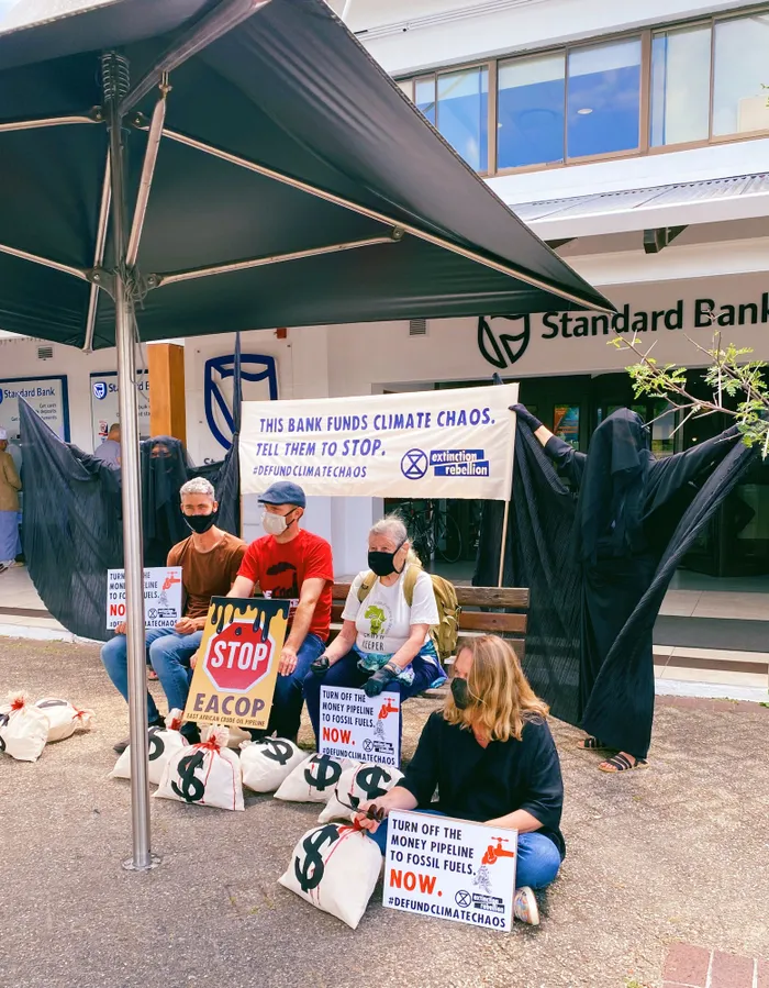 MEMBERS of Extinction Rebellion (XR) Cape Town banded together over the weekend for protest action outside the Standard Bank Constantia branch, in solidarity with the global Defund Climate Chaos campaign, to plead with Standard Bank to stop funding fossil fuel companies. | XR Cape Town