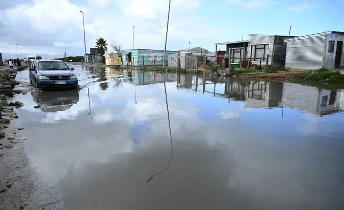 The Jk Masenoma Road was flooded near Island informal settlement in Khayelitsha. Picture: African News Agency (ANA)