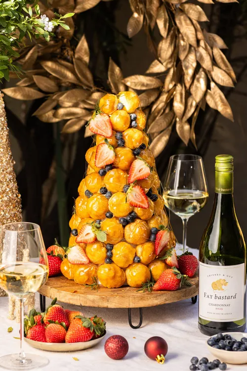 Crafting the perfect Croquembouche with Fresh Berries and Gold Leaf