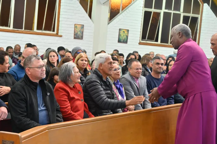 Archbishop Dr Thabo Makgoba with family members of the four people who died in the bus accident. St Aidan's Anglican Church hosted a memorial service for the four members who died in Swellendam when their bus driver lost control. Picture: Ayanda Ndamane/African News Agency (ANA)