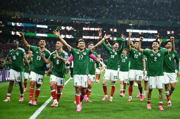 Mexico's players celebrate after winning their 2026 Fifa World Cup round-of-32 match against Ecuador.