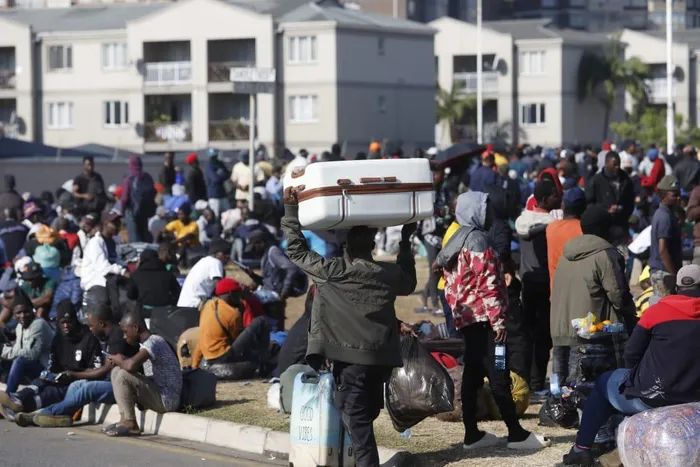 Thousands of Malawian foreign nationals, seeking refuge at the Durban drive-in site on North Beach, are going about their business, doing their laundry, shaving their hair, and selling food and other accessories, while others take advantage of Durban's warm weather, basking in the sun, waiting for their repatriation processes