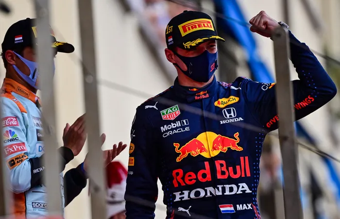 Winner Red Bull's Dutch driver Max Verstappen celebrates during the podium ceremony after the Monaco Formula 1 Grand Prix. Photo: AFP