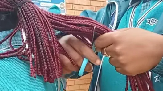 Debate ignites over school hair policies after viral TikTok shows braids being cut
