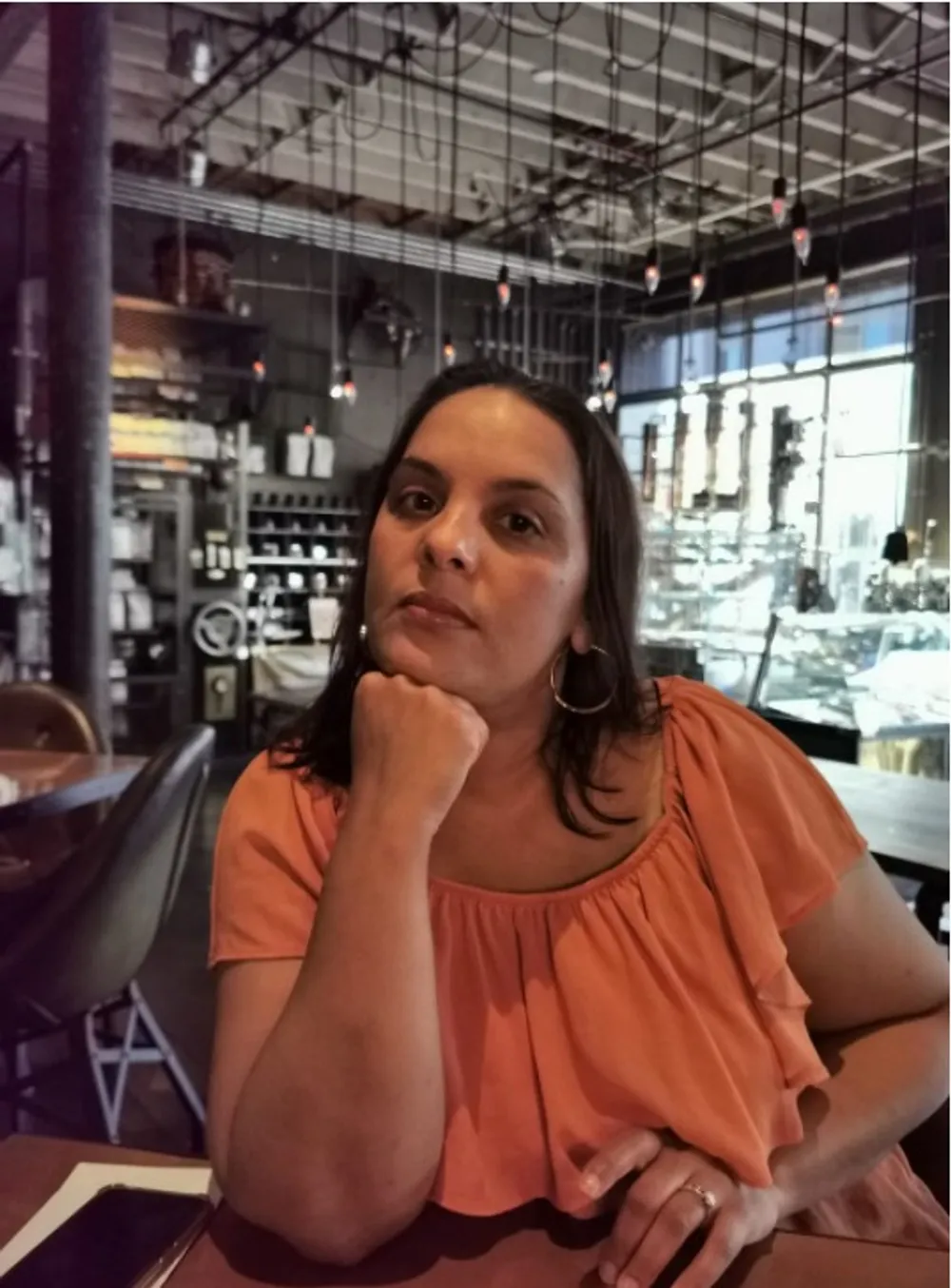 Woman in orange shirt.