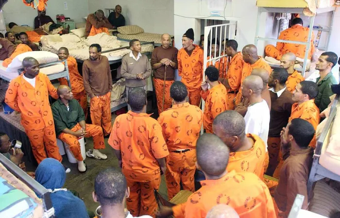 The Western Cape High Court has determined that the Minister of Correctional Services is entirely responsible for the damages, underscoring significant concerns regarding health management and negligence within the prison system. Depicted are prisoners in an overcrowded cell in Section B2 at Pollsmoor Prison.  