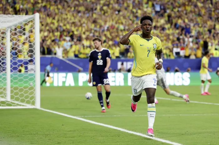 Vinícius Júnior celebrates after joining an elite club of Brazilian legends by scoring in all three World Cup group stage games. Photo: IANS