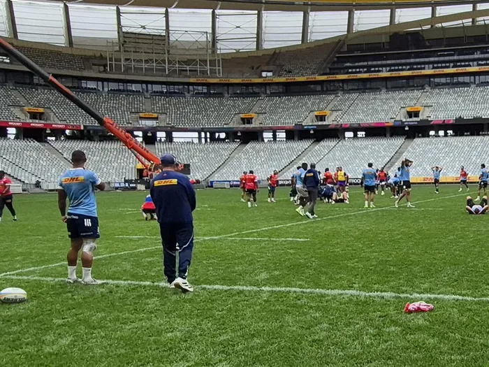 Stormers winger Leolin Zas watches training from the sidelines with an ice pack on his knee after a collision with fullback Damian Willemse during training on Wednesday ahead of the URC quarter-final against Cardiff this weekend.