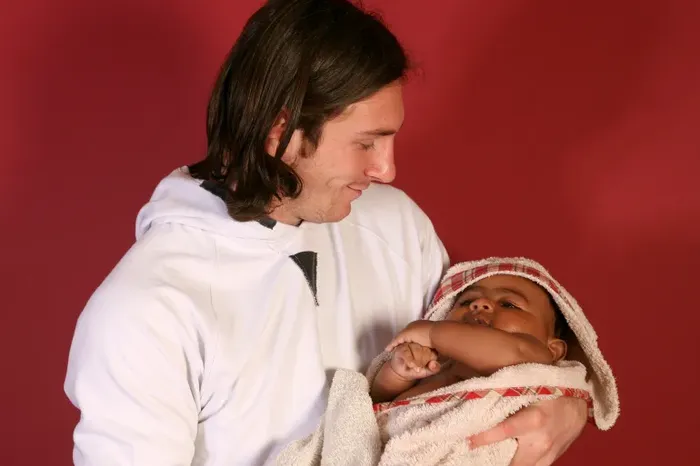Messi with baby Lamine.